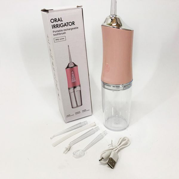 Ирригатор для чистки зубов и полости рта Oral Irrigator с аккумулятором и сменными насадками. Цвет: розовый ws12495-1 фото