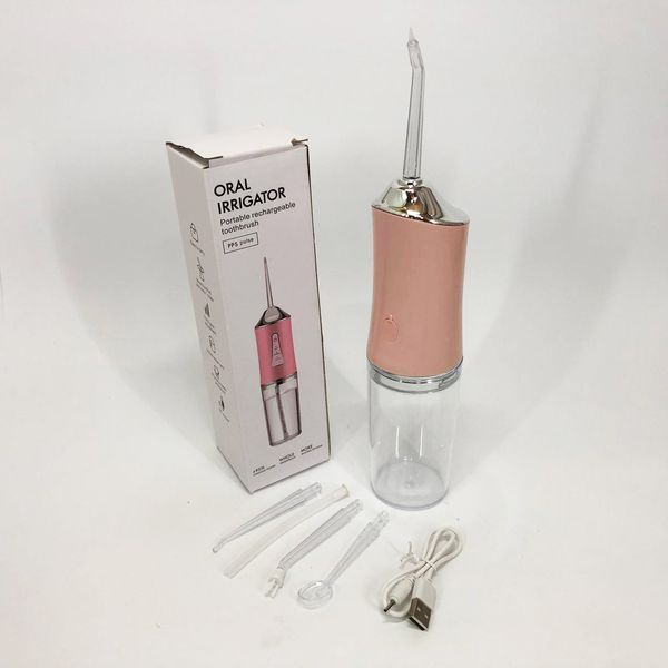 Ирригатор для чистки зубов и полости рта Oral Irrigator с аккумулятором и сменными насадками. Цвет: розовый ws12495-1 фото