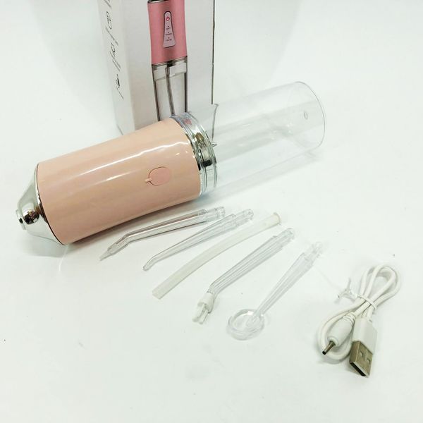 Ирригатор для чистки зубов и полости рта Oral Irrigator с аккумулятором и сменными насадками. Цвет: розовый ws12495-1 фото
