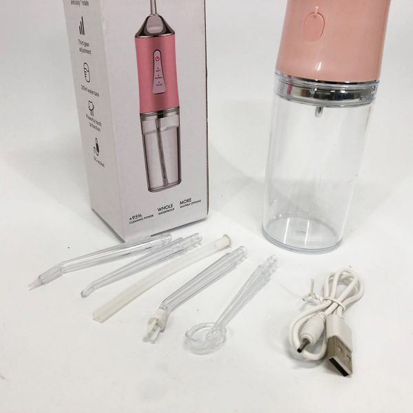 Ирригатор для чистки зубов и полости рта Oral Irrigator с аккумулятором и сменными насадками. Цвет: розовый ws12495-1 фото