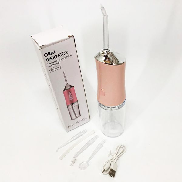 Ирригатор для чистки зубов и полости рта Oral Irrigator с аккумулятором и сменными насадками. Цвет: розовый ws12495-1 фото
