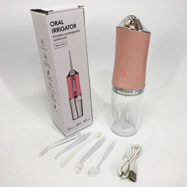 Ирригатор для чистки зубов и полости рта Oral Irrigator с аккумулятором и сменными насадками. Цвет: розовый ws12495-1 фото