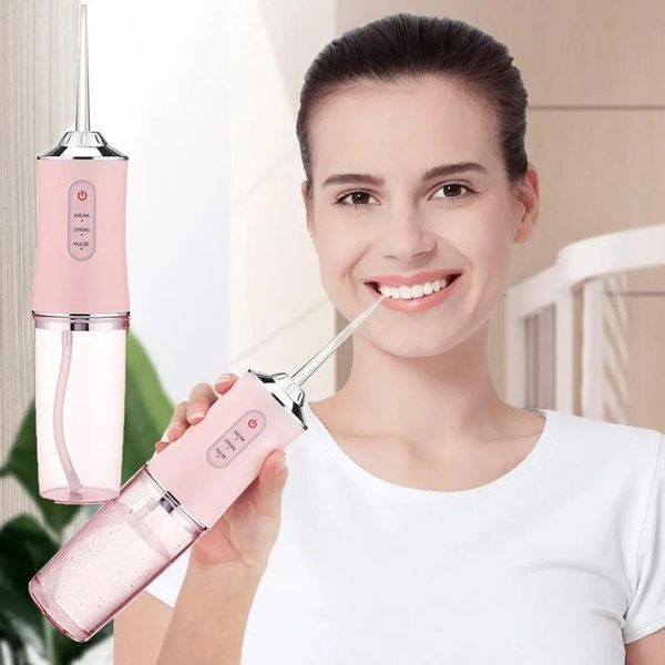 Ирригатор для чистки зубов и полости рта Oral Irrigator с аккумулятором и сменными насадками. Цвет: розовый ws12495-1 фото