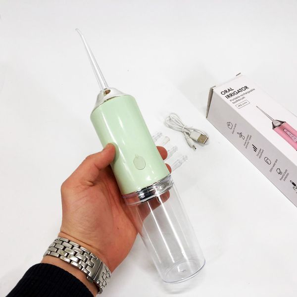 Ирригатор для чистки зубов и полости рта Oral Irrigator с аккумулятором и сменными насадками. Цвет: зеленый ws12495-2 фото